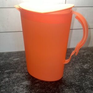 TUPPERWARE Vintage orange pitcher. Slim Impressions. New without tag